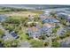 An aerial view shows a beautiful neighborhood with water views and lush green landscaping at 1647 Marsh Harbor Ln, Mount Pleasant, SC 29464