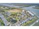 Breathtaking aerial view shows water community, pools, docks, and serene waterways, in a coastal setting at 1647 Marsh Harbor Ln, Mount Pleasant, SC 29464