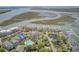 Stunning aerial showcasing houses near water, pools, docks, and lush landscapes, in a picturesque setting at 1647 Marsh Harbor Ln, Mount Pleasant, SC 29464