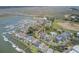 Gorgeous aerial view showcases waterfront community with pools, docks and boat slips, blending luxury and nature at 1647 Marsh Harbor Ln, Mount Pleasant, SC 29464