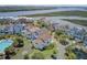 An aerial view shows a lovely waterfront community with beautiful homes and a community pool at 1647 Marsh Harbor Ln, Mount Pleasant, SC 29464