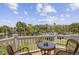 Picturesque balcony with comfortable seating and a stunning view of the water and lush greenery at 1647 Marsh Harbor Ln, Mount Pleasant, SC 29464