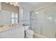 Bright bathroom featuring a glass shower, vanity, and built-in storage, providing a clean aesthetic at 1647 Marsh Harbor Ln, Mount Pleasant, SC 29464