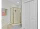Bright bathroom featuring a glass enclosed shower, marble floors, and a large, double door linen closet at 1647 Marsh Harbor Ln, Mount Pleasant, SC 29464