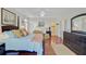 Spacious bedroom features natural light, four-poster bed, and comfortable seating at 1647 Marsh Harbor Ln, Mount Pleasant, SC 29464