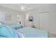 Bedroom with two beds, coastal bedding, a ceiling fan, a dresser with a TV, and access to another room at 1647 Marsh Harbor Ln, Mount Pleasant, SC 29464