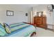 Bedroom with a wooden dresser, TV on the wall, and bed with coastal bedding and pillows at 1647 Marsh Harbor Ln, Mount Pleasant, SC 29464