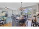 Elegant dining room with hardwood floors, stylish chandelier, and seamless flow into the living area at 1647 Marsh Harbor Ln, Mount Pleasant, SC 29464