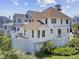 Beautiful beach house with multiple decks, lush landscaping, and desirable outdoor living spaces in a coastal community at 1647 Marsh Harbor Ln, Mount Pleasant, SC 29464
