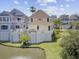 Lovely home with waterfront views and lush landscaping, offering a serene and picturesque coastal living experience at 1647 Marsh Harbor Ln, Mount Pleasant, SC 29464