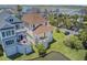 A beautiful three-story home with balconies, a well-maintained lawn, and a serene water view at 1647 Marsh Harbor Ln, Mount Pleasant, SC 29464