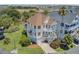 Beautiful home with balconies, lush landscaping, and garage, offering the perfect coastal living experience at 1647 Marsh Harbor Ln, Mount Pleasant, SC 29464