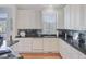 Stylish kitchen featuring white cabinetry, stainless steel appliances and tiled backsplash at 1647 Marsh Harbor Ln, Mount Pleasant, SC 29464