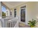 Inviting porch with rocking chairs, potted flowers, and view of the trees at 1647 Marsh Harbor Ln, Mount Pleasant, SC 29464