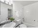 Cozy bathroom with a shower-tub combo, white cabinets, and a neutral color palette at 1705 Bassett Ct, Charleston, SC 29412
