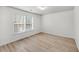 Bright bedroom features natural light and modern wood floors at 1705 Bassett Ct, Charleston, SC 29412