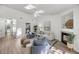 Bright and airy living room with a fireplace and modern furnishings, creating a welcoming space at 1705 Bassett Ct, Charleston, SC 29412