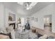 Comfortable living room showcasing a fireplace, ceiling fan, and sliding glass doors at 1705 Bassett Ct, Charleston, SC 29412