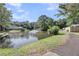 A beautiful pond surrounded by trees and a path beside the bank at 1705 Bassett Ct, Charleston, SC 29412