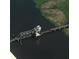 Aerial view of a bridge over a lake, surrounded by lush green vegetation and dark water at 1713 Pimlico Blvd, Moncks Corner, SC 29461
