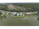 Aerial shot showcasing waterfront homes, swimming pools, and lush greenery along the lakeside at 1713 Pimlico Blvd, Moncks Corner, SC 29461