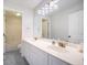 Bathroom featuring dual sinks, vanity, large mirror, and shower and tub combo at 1713 Pimlico Blvd, Moncks Corner, SC 29461