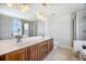 Well-lit bathroom with double sinks, vanity, large mirror, and glass shower enclosure at 1713 Pimlico Blvd, Moncks Corner, SC 29461