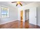 Bedroom with hardwood floors, ceiling fan, and en-suite bathroom at 1713 Pimlico Blvd, Moncks Corner, SC 29461