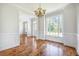 Dining room with wainscoting and a large window, situated near the foyer and with hardwood floors at 1713 Pimlico Blvd, Moncks Corner, SC 29461