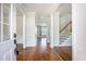 Inviting foyer featuring hardwood floors and a staircase leading to the upper level of the home at 1713 Pimlico Blvd, Moncks Corner, SC 29461