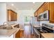 Kitchen with stainless appliances, granite counters and cabinetry overlooking dining room at 1713 Pimlico Blvd, Moncks Corner, SC 29461