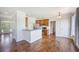 Kitchen with stainless steel appliances, breakfast bar with granite countertops, and hardwood floors at 1713 Pimlico Blvd, Moncks Corner, SC 29461