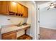 Office space with built-in desk and wood cabinets, and hardwood floors at 1713 Pimlico Blvd, Moncks Corner, SC 29461