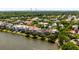 Aerial view featuring waterfront homes surrounded by lush greenery and Charleston bridge at 18 Fernandina St, Mount Pleasant, SC 29464