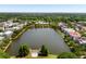 Community with waterfront homes surrounding a lake, featuring lush landscaping at 18 Fernandina St, Mount Pleasant, SC 29464
