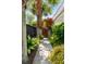 Stone pathway leading to a charming wooden gate surrounded by lush landscaping at 18 Fernandina St, Mount Pleasant, SC 29464