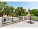 Balcony overlooking lush palm trees and blue sky, perfect for outdoor relaxation at 18 Fernandina St, Mount Pleasant, SC 29464