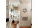 Nautical-themed bathroom with window seating, wood floors, and stylish fixtures at 18 Fernandina St, Mount Pleasant, SC 29464