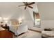Bright bedroom with white furniture, wooden floors, and a window seat at 18 Fernandina St, Mount Pleasant, SC 29464