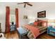 Stylish bedroom with ceiling fan, hardwood floors, patterned curtains and an accent bench at 18 Fernandina St, Mount Pleasant, SC 29464