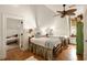 Charming bedroom features twin beds, a ceiling fan, and a cozy window nook at 18 Fernandina St, Mount Pleasant, SC 29464