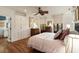 Bedroom with a ceiling fan, natural lighting, and built in closets and dresser providing an open space at 18 Fernandina St, Mount Pleasant, SC 29464