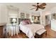 Bedroom with a ceiling fan, plush bedding, and a view into the home's living area at 18 Fernandina St, Mount Pleasant, SC 29464