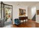 Elegant foyer featuring hardwood floors, wainscoting, chandelier, and a view into the front yard at 18 Fernandina St, Mount Pleasant, SC 29464