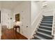 Hallway with hardwood floors, carpeted stairs, and white walls for a clean and welcoming entry at 18 Fernandina St, Mount Pleasant, SC 29464