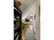 Upstairs hallway featuring hardwood floors, storage and a small sitting area at 18 Fernandina St, Mount Pleasant, SC 29464