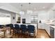 Bright, updated kitchen featuring pendant lights, an island, and stainless steel appliances at 18 Fernandina St, Mount Pleasant, SC 29464