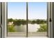 Scenic lake view from a window overlooking calm water and houses at 18 Fernandina St, Mount Pleasant, SC 29464