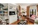 Cozy living room showcasing built-in bookshelves and a view through a wooden column to the bedroom at 18 Fernandina St, Mount Pleasant, SC 29464
