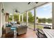 Spacious porch with ceiling fans and lake views, perfect for outdoor relaxation at 18 Fernandina St, Mount Pleasant, SC 29464